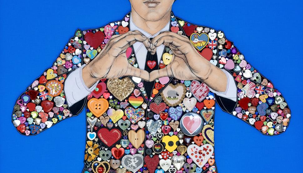 a textile art depiction of Paul McCartney of the Beatles made with a selection of heart shaped buttons and badges a textile art depiction of Paul McCartney of the Beatles made with a selection of heart shaped buttons and badges