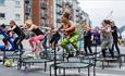 A group of people at the Sweat Festival in Portsmouth doing a trampolining class