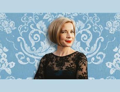 Lucy Worsley with a blue background
