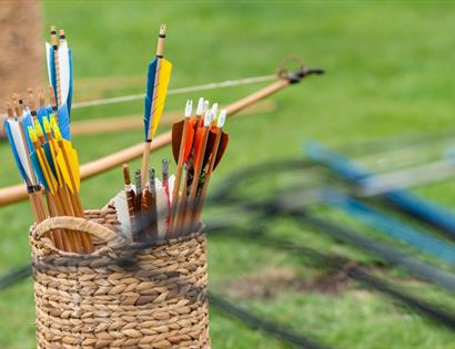 archery bows in a basket.