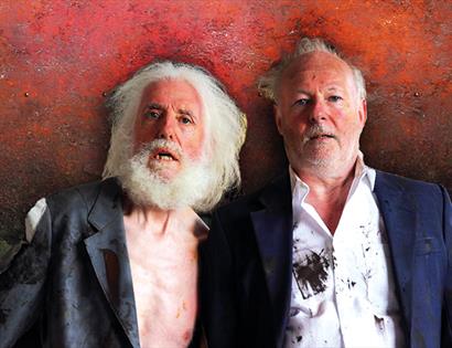 portrait of two men with shocked expressions