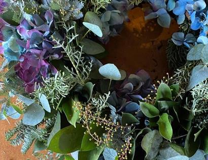 a close up of a foliage wreath