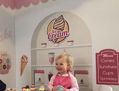 Child in a play ice cream parlour