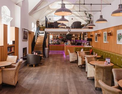 Kino Rye café with stylish seating, vaulted ceilings and a welcoming bar area in a converted historic building.