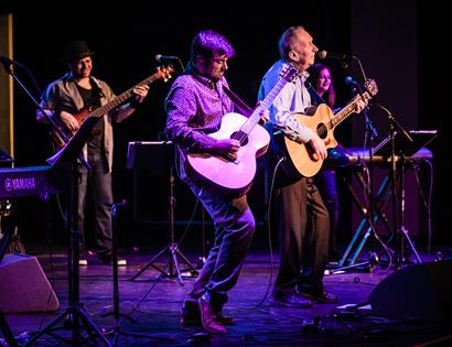 Photo of the band on stage