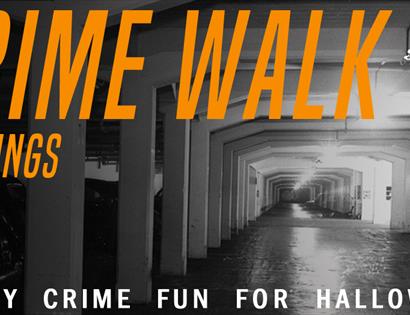 a black and white photograph of an underground car park with with orange text over the top saying Crime Walk.