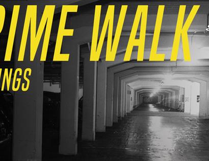 A poster for the Crime Walk event by the True Crime Museum Hastings. a black and white photograph of an underground carpark, with yellow lettering ove