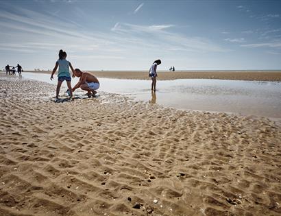 Children playing at low tide on Camber Sands