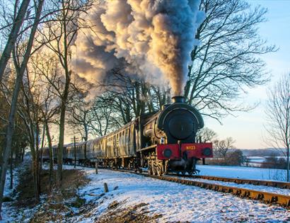 steam engine from front, in snowy landscape.