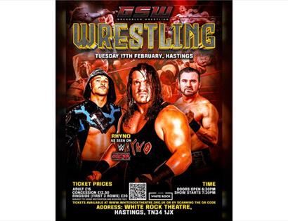 GS wrestling event poster for Hastings, featuring three muscular wrestlers, dramatic lighting and bold text with date, venue, and ticket details.