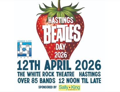 Poster for Hastings Beatles Day 2026 featuring a large strawberry and event details for 12 April at White Rock Theatre.