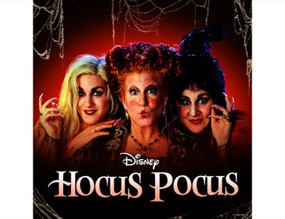Promotional image for Disney’s Hocus Pocus featuring the Sanderson sisters against a spooky Halloween backdrop.