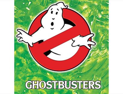Ghostbusters logo featuring the iconic ghost symbol inside a red no-entry sign on a green slime background.