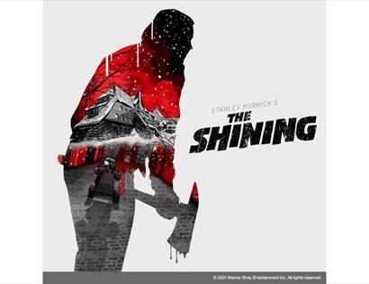 Promotional artwork for The Shining featuring a silhouetted figure and the Overlook Hotel in a red-and-black design.
