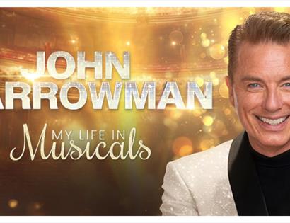 Promotional image for John Barrowman: My Life in Musicals, featuring a theatre backdrop and portrait.