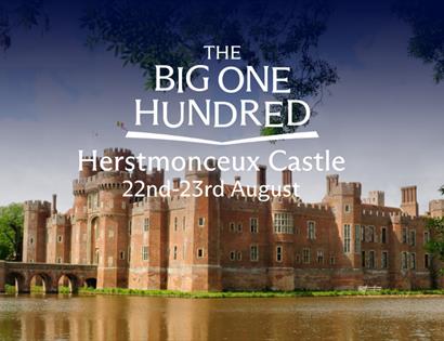 Herstmonceux Castle reflected in its moat, promoting The Big One Hundred celebration on 22 to 23 August.