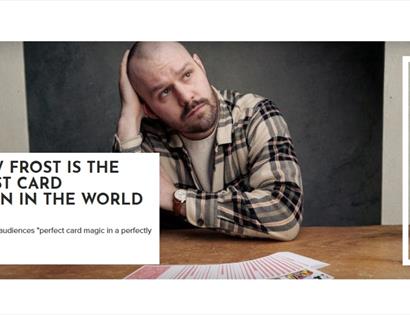 Promotional image for card magician Andrew Frost, showing a performer seated at a table with playing cards spread out.