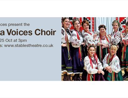 Poster for Volya Voces Choir performance, featuring choir members in traditional embroidered folk costumes.