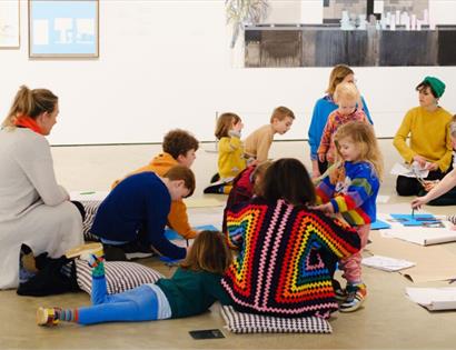 Families taking part in a creative workshop during a Family Day event at Hastings Contemporary gallery.