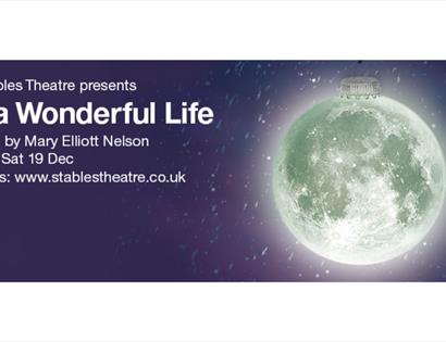 Poster for “It’s a Wonderful Life” featuring a moon-shaped Christmas bauble glowing against a snowy night sky.