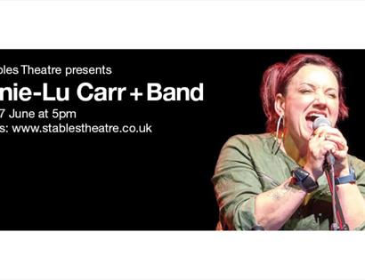Poster for Dannie‑Lu Carr + Band, showing a vocalist singing into a microphone on stage, with event date and booking details.