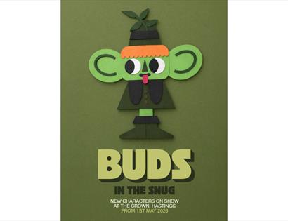 Green paper-cut style character with large ears and leaf hat above text: “Buds in the Snug” on olive background.