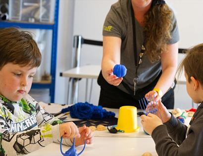 Children take part in a hands-on coastal wildlife activity led by staff at Rye Harbour Nature Reserve.