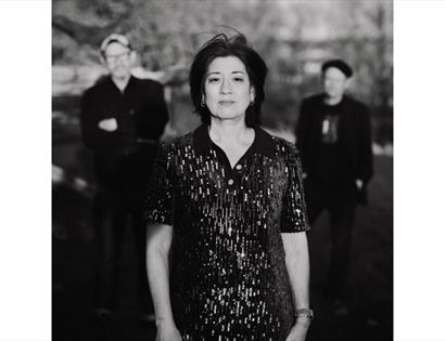 Promotional image for Miki Berenyi Trio at De La Warr Pavilion, showing three band members in a monochrome portrait.