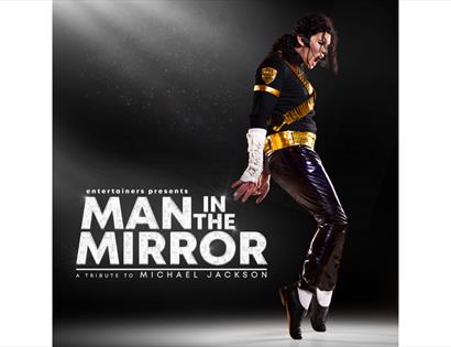 Poster for 'Man in the Mirror,' a Michael Jackson tribute show featuring a performer in a signature dance pose.