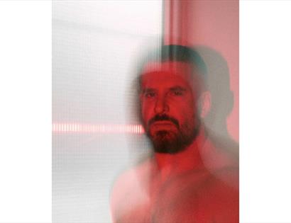 Abstract red-toned portrait with motion blur promoting SMOKE by Alexis Gregory and the You Are Loved community panel.