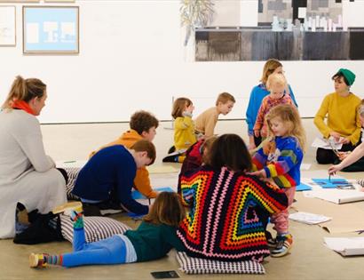 Families taking part in creative art activities during a Family Day workshop at Hastings Contemporary gallery.