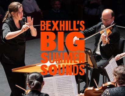 Promotional image for Bexhill’s Big Summer Sounds showing an orchestra performing, with a conductor and string players on stage.