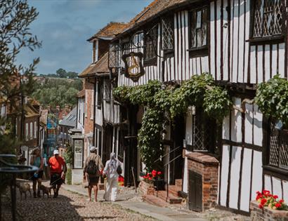 The Mermaid Inn on historic Mermaid Street in Rye, a timber-framed Tudor building draped with climbing greenery.