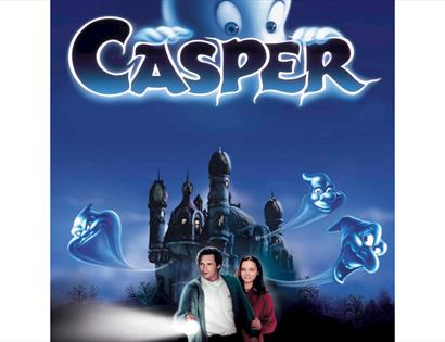 Casper movie poster featuring friendly ghosts, a haunted mansion and characters holding a flashlight at night.