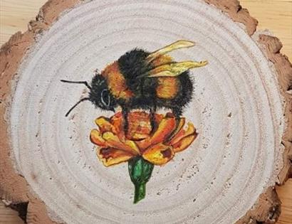 artwork, a slice of wood with painted butterfly on orange flower, white painting background