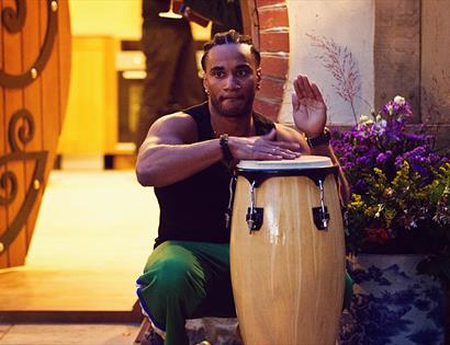 Musician plays Brazilian music on a drum