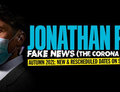 poster for Jonathan Pie at White Rock Theatre. Black background. White man in suit and blue face mask stands to left. Text says Jonathan Pie, Fake New