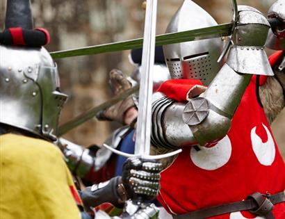 knights in armour fighting with swords