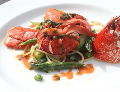 A gourmet lobster dish served plate.