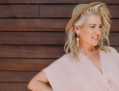 Lucinda Light smiling wearing a pink dress