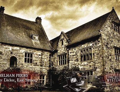 photograph of an old stone country house with ominous clouds above it.