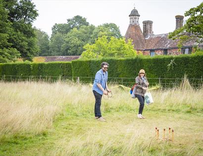 Summer of Play at Bateman’s, with visitors enjoying traditional lawn games in the grounds of the historic house.