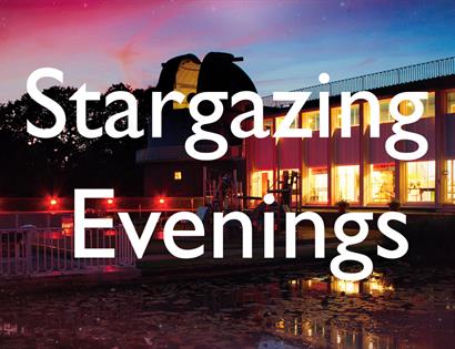 a photogrpah of a building at sunset, with orange lights in the building and blue and pink sky. Obstructed by large with letters that say Stargazing E