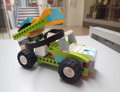 Lego vehicle on a table.
