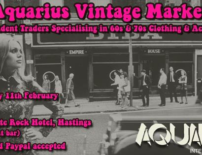 poster with black and white photograph showing sixties highstreet and model Twiggy. Text overlaying is bright pink, text as in description.