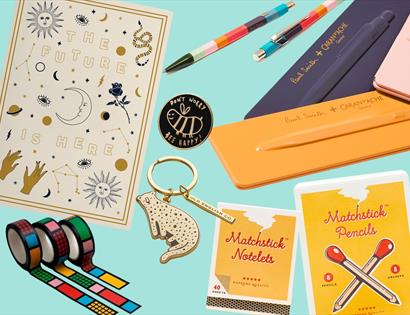 Illustration showing small gifts such as pencils, tape and keyrings.