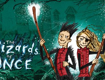 a green illustrated poster. To the left says 'The Wizards of Once'. To the right are character illustrations of boy and girl holding staffs. Girl has