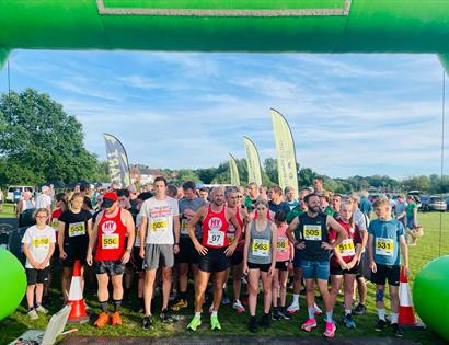 large group stood at running race start line