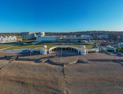 aerial view of De La Warr Pavilion, lawns and shingle beach.