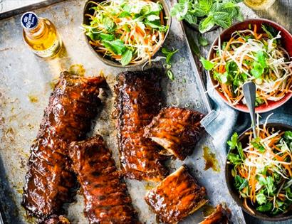 Rack of BBQ ribs with salad and beer